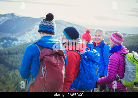 Portrait smiling man hiking with family on mountain Stock Photo