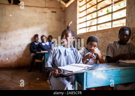 NAIROBI, KENYA-SEPTEMBER 10, 2014: Unidentified girls study in a simple classroom near Nairobi, Kenya. Stock Photo