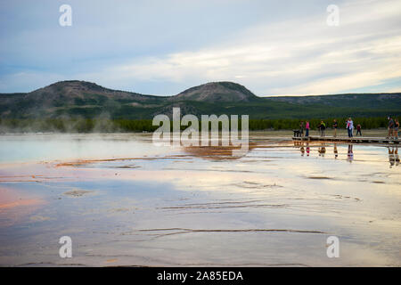Tourists view Grand Prismatic Spring from the boardwalk Stock Photo