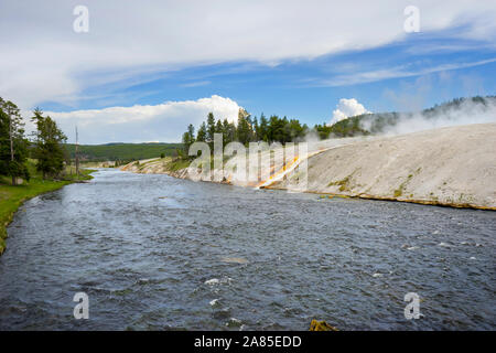 Firehole River with colorful drainage channel from Excelsior Geyser Stock Photo