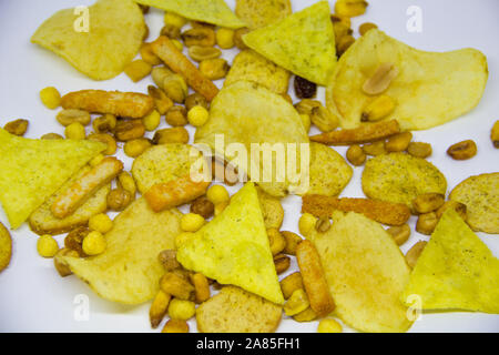 beer mix, crackers, chips, nuts, peanuts, salted corn on a white background Stock Photo