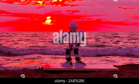 Humanoid autonomous smart Robot dances above martian sea after a weightless day in the spaceship. Dancing helps him to maintain his muscles and servos after a long day in Space. Stock Photo