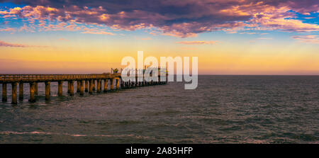 Sunset over the old historic jetty in Swakopmund, Namibia Stock Photo