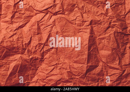 Red wrapping paper, crumpled paper texture. Creased sheet background. Stock Photo