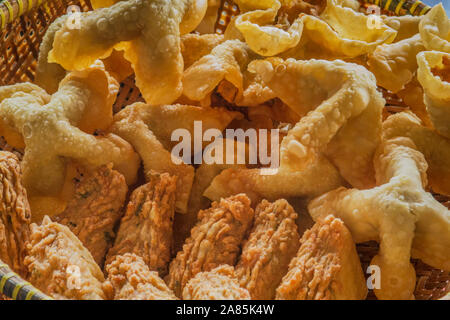 A Sundanese dish from Southeast Asia, originating from Indonesia, consisting of fried fish dumplings, usually served with peanut sauce called batagor Stock Photo