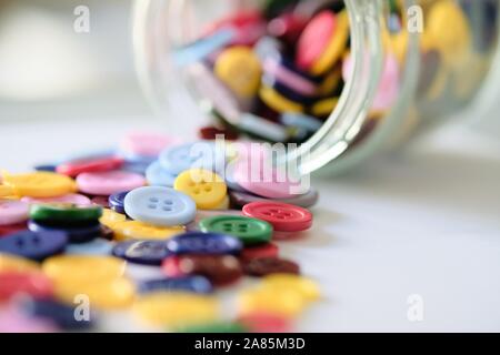 Large Group Of Colorful Plastic Sewing Buttons In A Can On Table, With Copy Space For Text Stock Photo