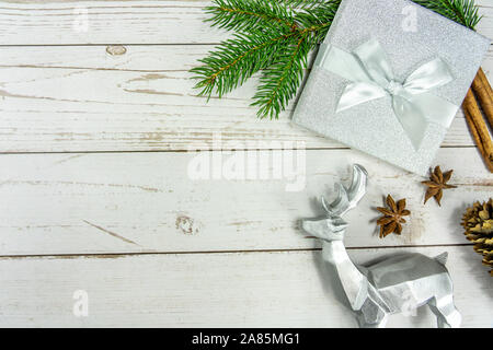 Christmas frame background on white wood with silver and natural decoration Stock Photo