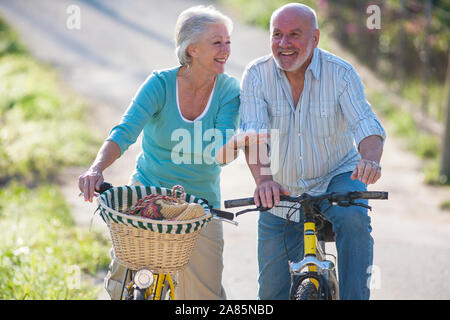 Senior couple cycling Stock Photo