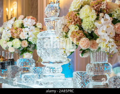 Decorations for banquet with shape cutting of blocks of ice and flowers Stock Photo