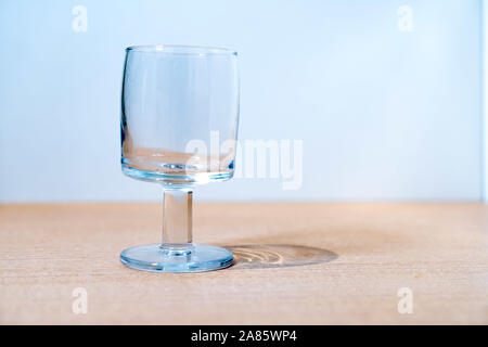 An empty glass goblet on the table Stock Photo