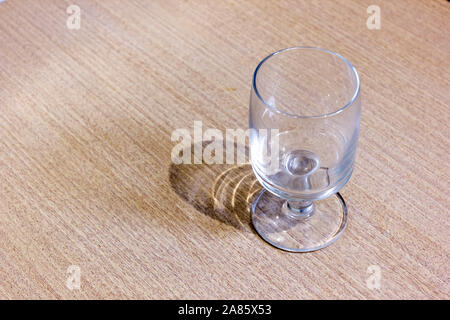 An empty glass goblet on the table Stock Photo