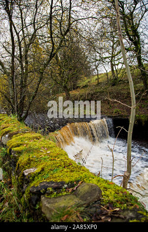 The River Dee flows through Cowgill, Dentdale, North Yorkshire,UK, after a heavy downpour of rain Stock Photo