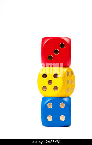 Three Dice in primary colours Stacked on top of each other isolated on white background, gambling or kids preschool numbers education concept Stock Photo