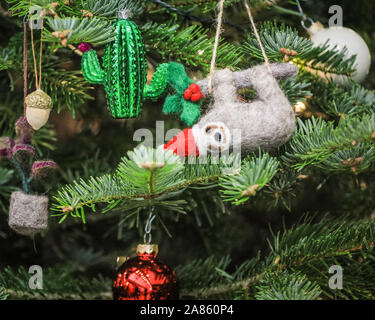 Olympia London, London, UK. 6th Nov, 2019. A sloth is one of the more unusual tree decorations sold. This year's Spirit of Christmas Fair presents an unrivalled collection of 900 independent boutique retailers and designer-makers as well as over 100 artisan food producers at the majestic Olympia London exhibition halls. The fair is an exclusive Christmas shopping experience open to the public, and runs unitl Nov 10th this year. Credit: Imageplotter/Alamy Live News Stock Photo
