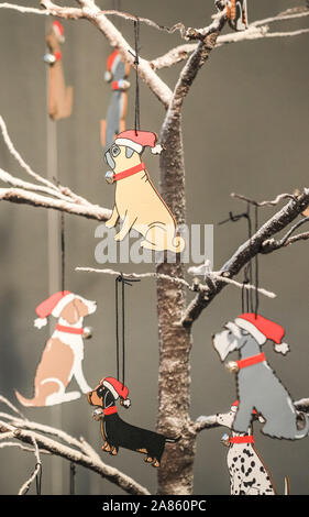 Olympia London, London, UK. 6th Nov, 2019. Sweet William Designs sells doggy Christmas tree decorations for the canine lover. This year's Spirit of Christmas Fair presents an unrivalled collection of 900 independent boutique retailers and designer-makers as well as over 100 artisan food producers at the majestic Olympia London exhibition halls. The fair is an exclusive Christmas shopping experience open to the public, and runs unitl Nov 10th this year. Credit: Imageplotter/Alamy Live News Stock Photo
