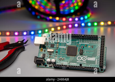 Arduino Mega2560 displayed with LED strip and wire cutters. Stock Photo