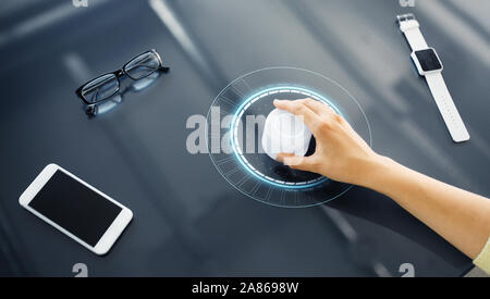 hand with control knob on interactive panel Stock Photo