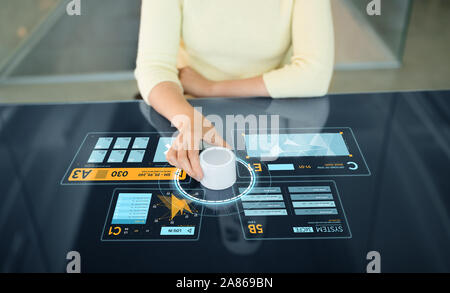 woman with control knob on interactive panel Stock Photo