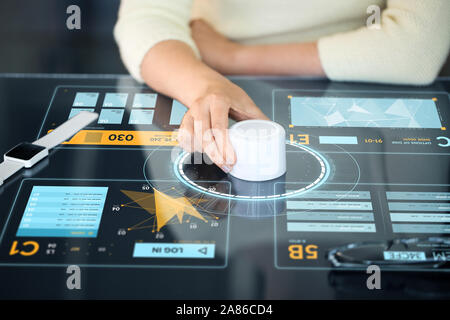 woman with control knob on interactive panel Stock Photo