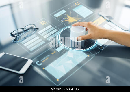 hand with control knob on interactive panel Stock Photo