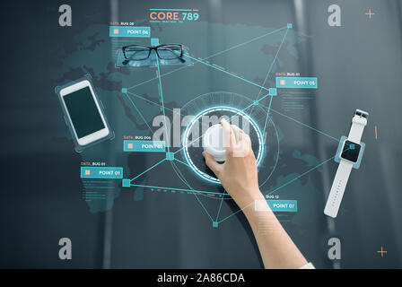 hand with control knob on interactive panel Stock Photo
