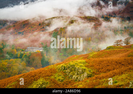 Clouds and autumn colors in the Lake District Fells near Ambleside, England Stock Photo