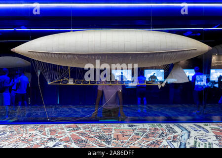 Exposition of historic aviation scaled model of a zeppelin above a map Stock Photo