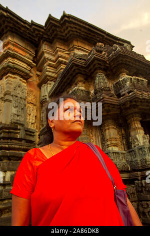 Indian woman visiting Chennakeshava Temple at Belur town, Karnataka, India Stock Photo