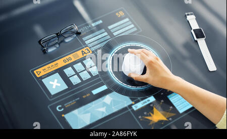 hand with control knob on interactive panel Stock Photo
