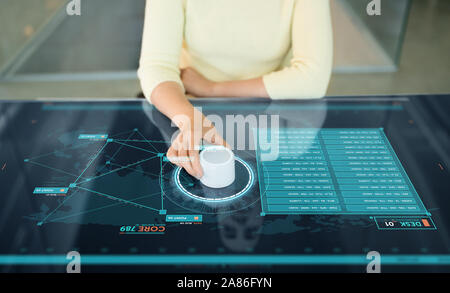 woman with control knob on interactive panel Stock Photo