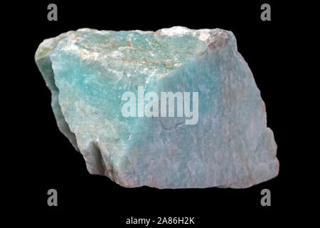 Rock of green amazonite mineral (or amazonstone) from Russia isolated on a pure black background Stock Photo