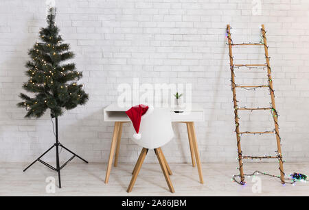 Light Christmas office interior with decorated pine tree Stock Photo