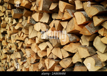 Pile of the chopped wood logs for firewood with selective focus Stock Photo