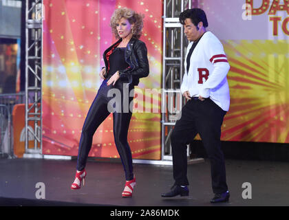 Hosts Savannah Guthrie and Carson Daly dressed as Sandy Olsson and Danny Zuko of 'Grease' during NBC's 'Today' Halloween Celebration at Rockefeller Pl Stock Photo