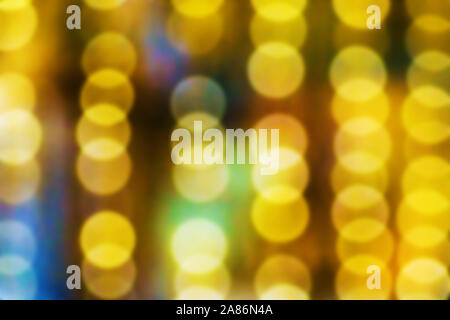 Lights of the night city. Bokeh with blurry lights on a dark background. Storefront lighting. Christmas Stock Photo
