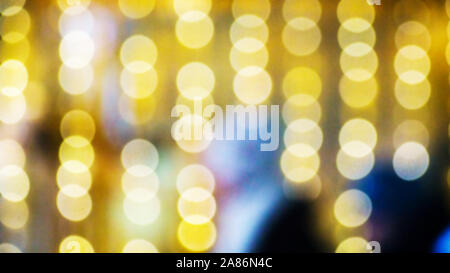 Lights of the night city. Bokeh with blurry lights on a dark background. Storefront lighting. Christmas Stock Photo