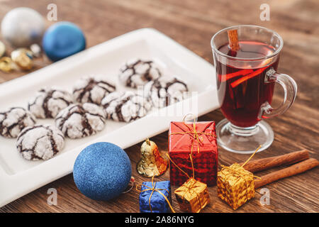 Perparing traditional cookies and gluhwein or mulled wine for new year celebration. Stock Photo