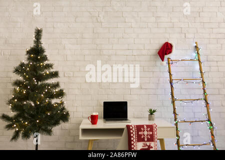 Tradition Christmas atmosphere in office over white bricks wall Stock Photo