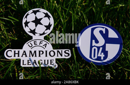 September 6, 2019 Istanbul, Turkey. The emblem of the German football club Schalke 04 Gelsenkirchen next to the logo of the Champions League on the gr Stock Photo