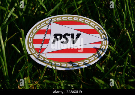 September 6, 2019 Istanbul, Turkey. The emblem of the Dutch football club PSV Eindhoven on the green grass of the football field. Stock Photo