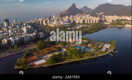 Aerial panorama of the city lake of Rio de Janeiro with exclusive club Caiçaras on the island in Ipanema in the foreground and neighbourhood of Leblon Stock Photo