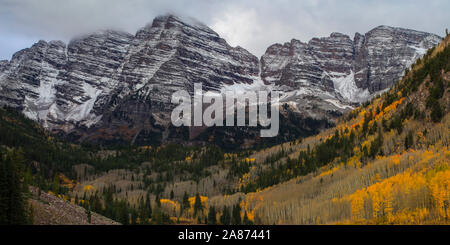 Maroon Bells Wilderness Colorado Rocky Mountains with snow and autumn colors of aspen forest Stock Photo