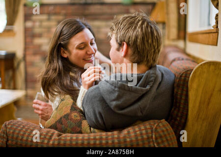 Couple relaxing on sofa Stock Photo