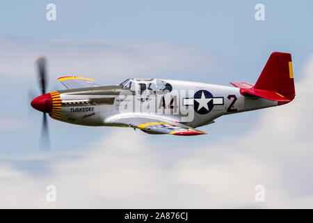 VANDALIA, OHIO / USA - JUNE 23, 2018: A World War II era P-51 Mustang from the 'Red Tails' squadron performing at the 2018 Vectren Dayton Airshow. Stock Photo