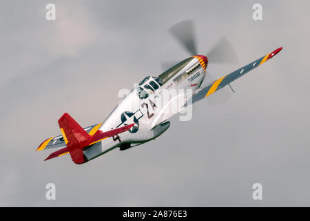 VANDALIA, OHIO / USA - JUNE 23, 2018: A World War II era P-51 Mustang from the 'Red Tails' squadron performing at the 2018 Vectren Dayton Airshow. Stock Photo