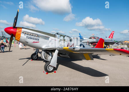 VANDALIA, OHIO / USA - JUNE 23, 2018: A World War II era P-51 Mustang from the 'Red Tails' squadron performing at the 2018 Vectren Dayton Airshow. Stock Photo