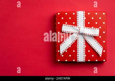 Flat lay red polka dots gift box Stock Photo