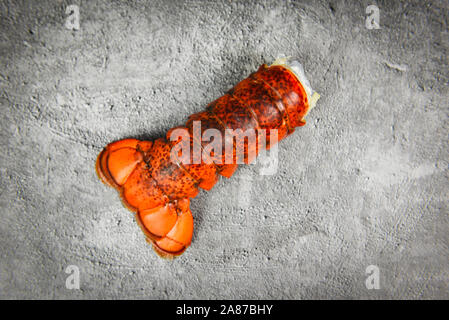 Lobster tail on dark plate background / red lobster food on dining table Stock Photo