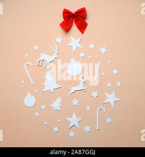 Bauble Made of Paper Cutting Christmas on Peach Background. Flat lay Top View Stock Photo