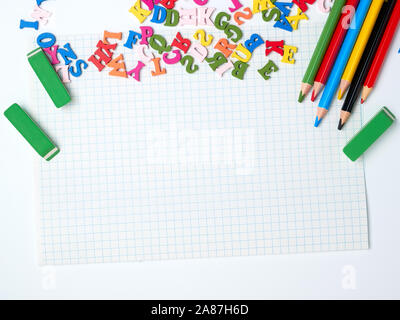 blank white sheet of squared papers and school supplies, back to school Stock Photo